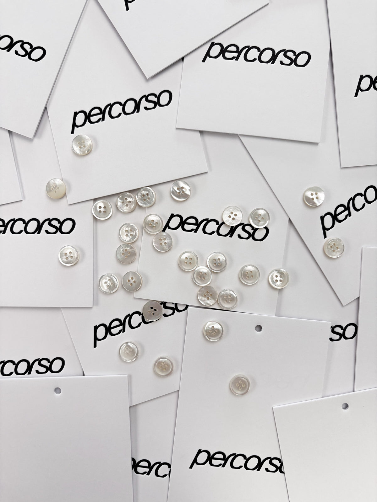 Mother of pearl buttons on Percorso cards